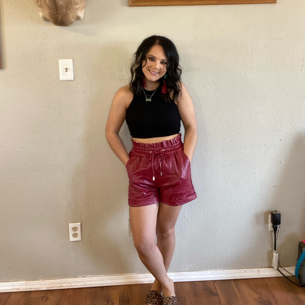 Red crocodile leather shorts. Elastic waist band so it does stretch.